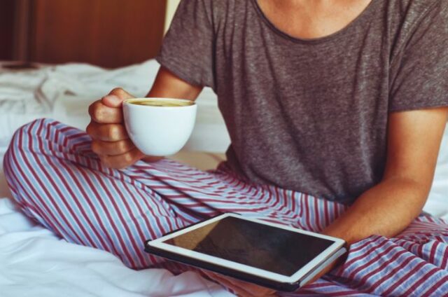 eco-friendly pajamas - woman with ipad in bed