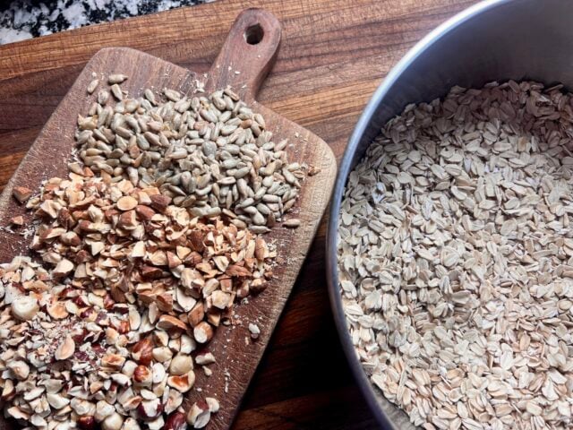granola ingredients - rolled oats, chopped nuts and seeds