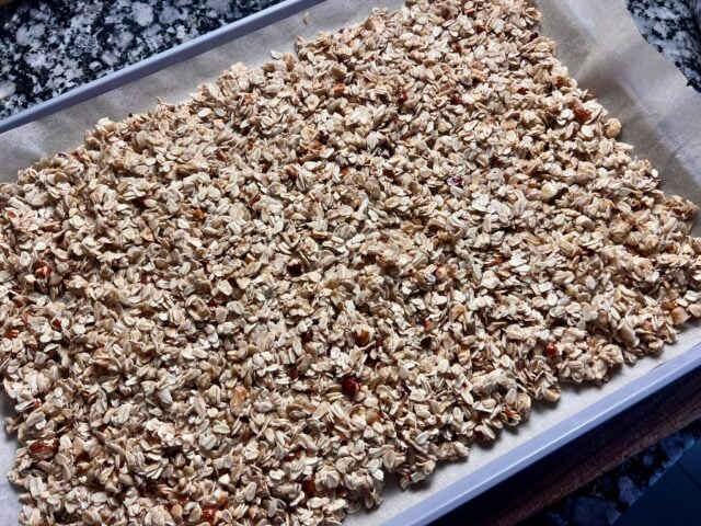 granola mixture on baking sheet before baking