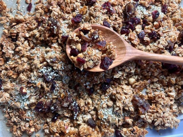 homemade granola on pan with spoon