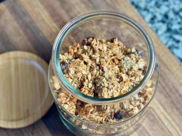 homemade granola stored in a glass jar with lid