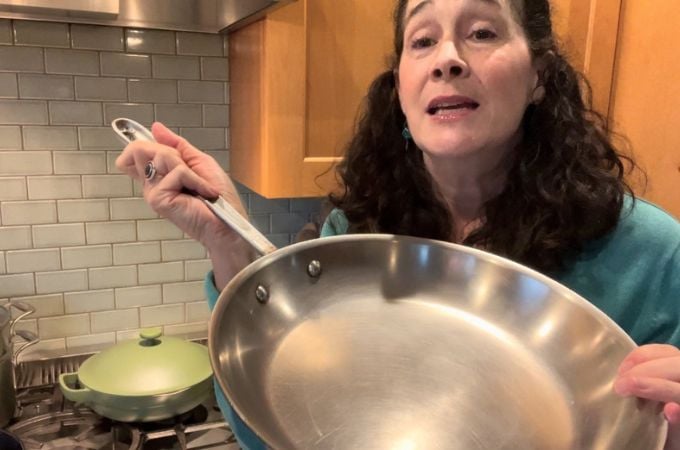 Micaela holding non toxic cookware pan