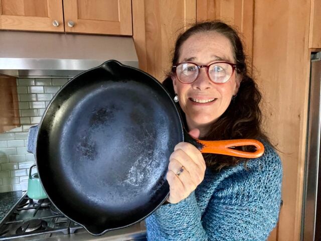 Mindful Momma holding Le Crueset pan