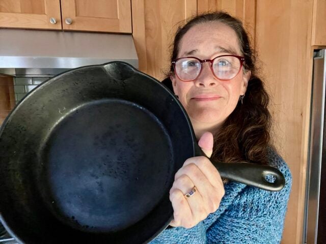 Mindful Momma holding Lodge cast iron pan