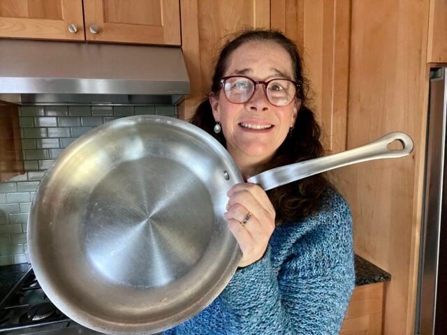 Mindful Momma holding Quince stainless steel sauté pan