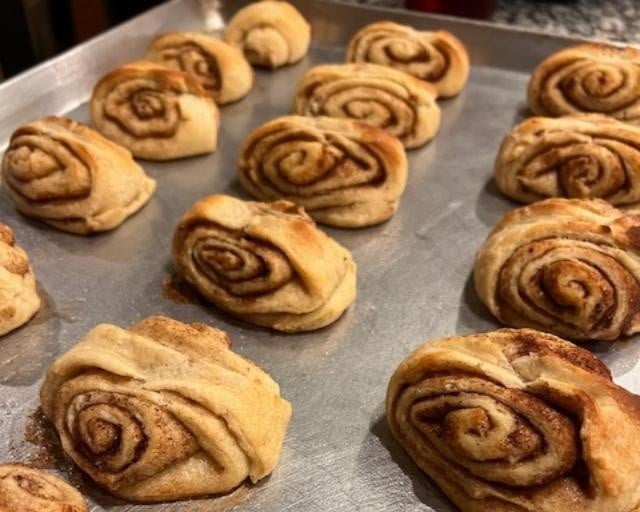 cinnamon rolls on baking sheet
