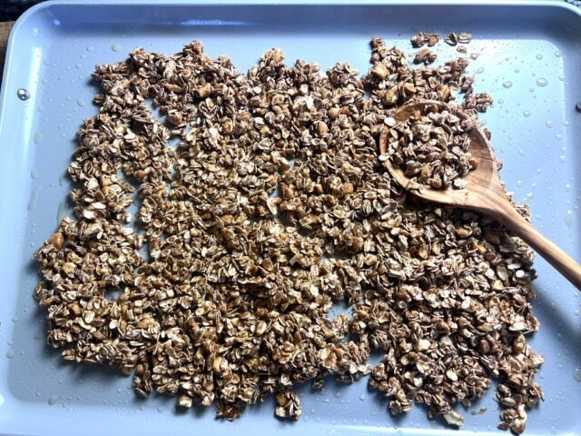 granola on baking sheet before cooking